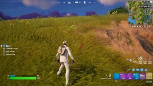 A man in a white shirt is standing in a grassy field as the Fortnite Ninja Turtle challenge confuses the community.