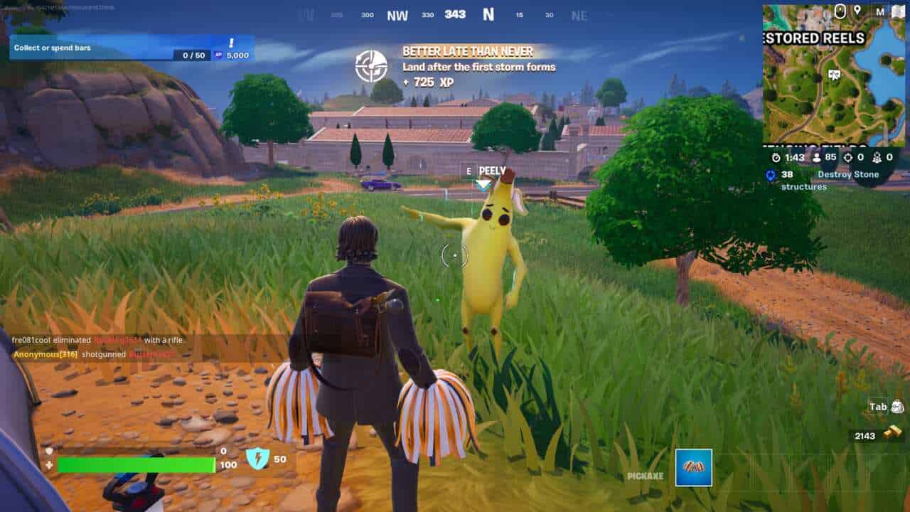 Fortnite Mending Machines: A player standing in front of Peely on top of a grassy hill in Fortnite.