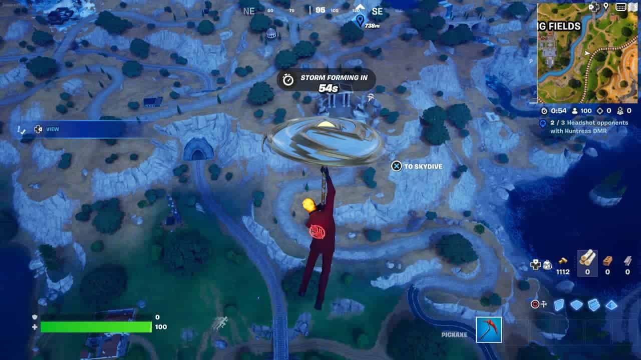 A player parachuting with the new Fortnite umbrella over a landscape at night in a battle royale video game in Chapter 5 Season 2.