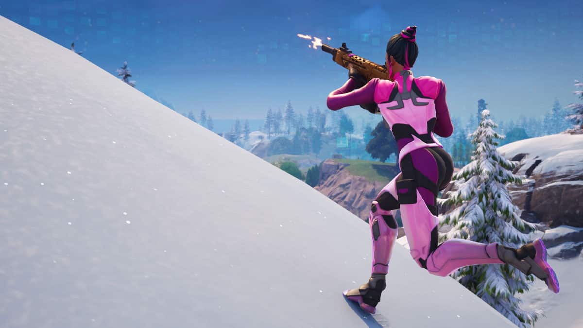 A woman in a pink suit is gracefully gliding down a snowy slope.