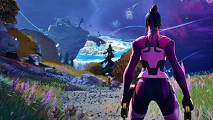 An image of a woman standing on a path.