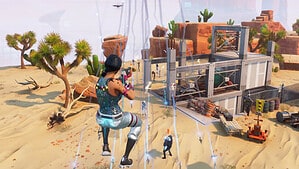 How to play Fortnite Save the World: A player jumping down towards a building surrounded by Husks in Save the World.