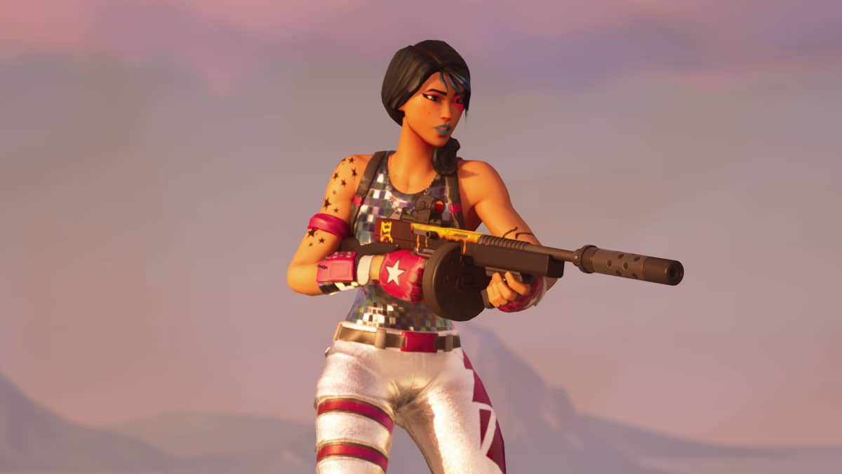 A female video game character holding a sniper rifle, dressed in a patriotic tank top and silver pants, standing in a Fortnite Zero Build desert-like setting at sunset.