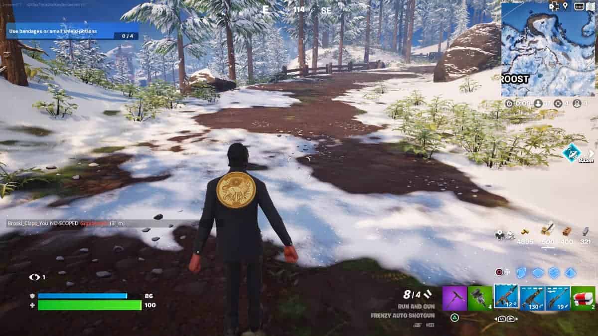 A man is walking down a snowy path in Fortnite, using his best sweaty Fortnite name to incite fear in his opponents.