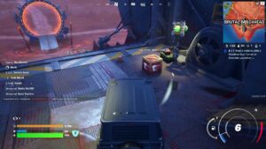 Fortnite vehicle mods: A large 4x4 next to a crate in a large hangar.