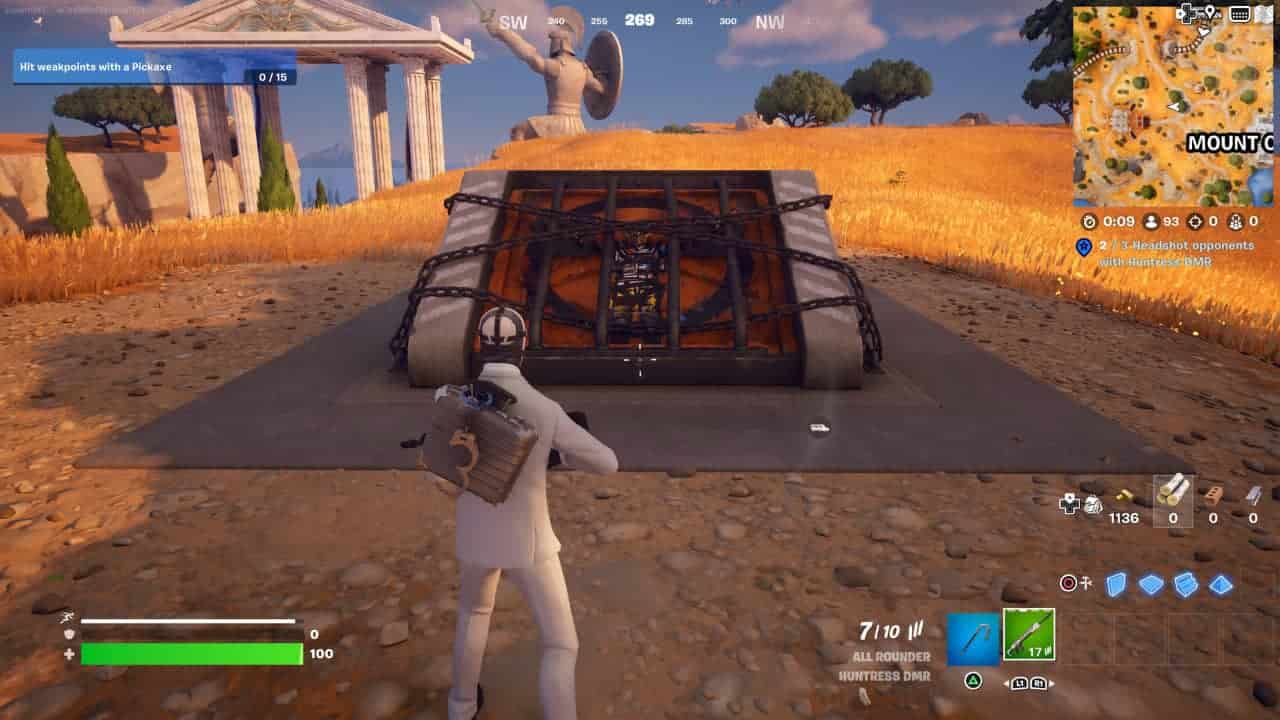 A player in a white outfit stands in front of a vehicle on a farm within a Fortnite video game environment.