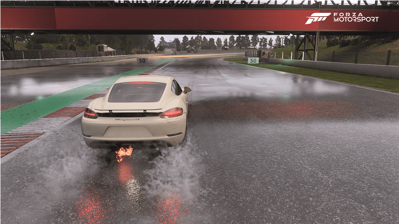 Forza Motorsport review: An image of a car racing in the rain.
