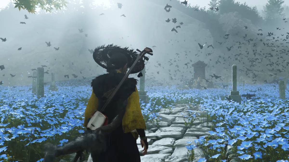 Ghost of Yotei PS5 Pro Enhanced: Atsu walking through a meadow of blue flowers.