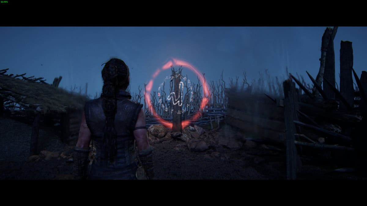 Hellblade 2 Lorestangir locations: Senua in the dark standing near a runic totem.