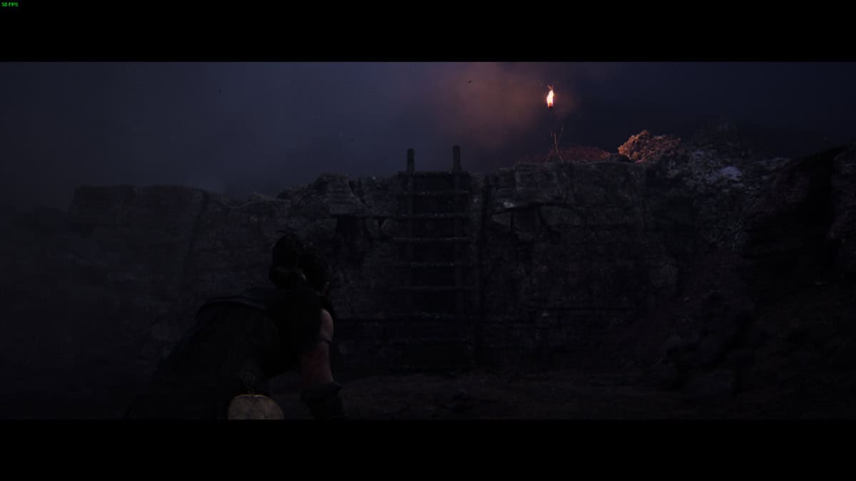 Hellblade 2 Lorestangir locations: Senua in the dark standing near a ladder.