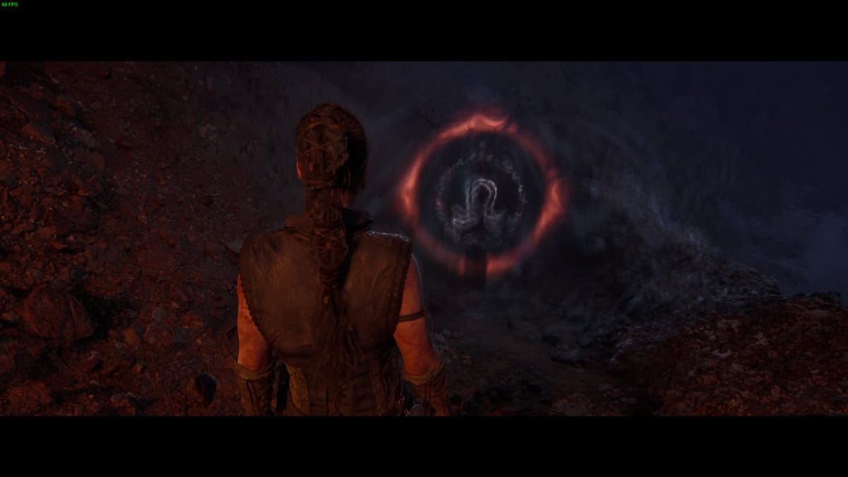Hellblade 2 Lorestangir locations: Senua in the dark standing near a runic totem.
