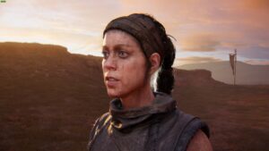 Hellblade 2 Lorestangir locations: Senua stands outdoors at sunset with hills and a flag in the background.
