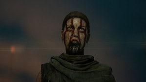 Hellblade 2 how long: Senua with red paint on her face looking menacing.