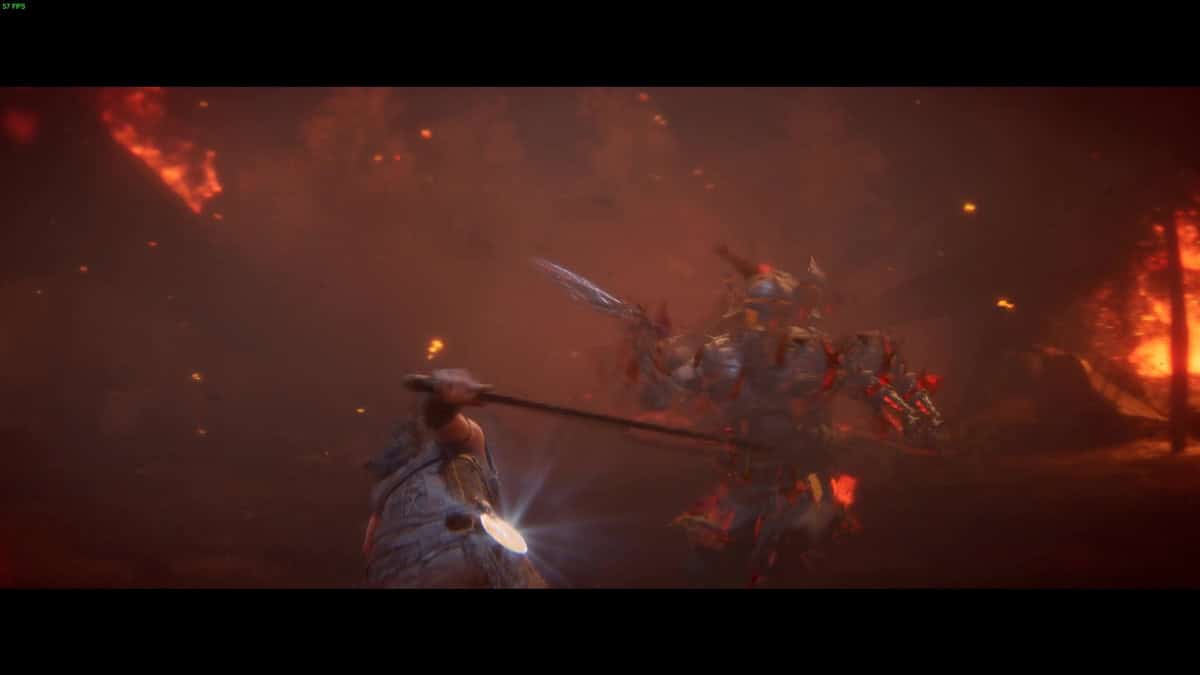 Hellblade 2 tips and tricks: combat in a dark environment with dust flying. 