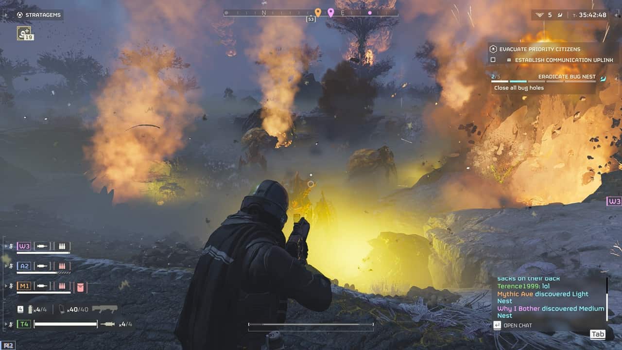 A player character in a Helldivers 2 best armor observes an explosion in a fiery, dystopian landscape during gameplay.