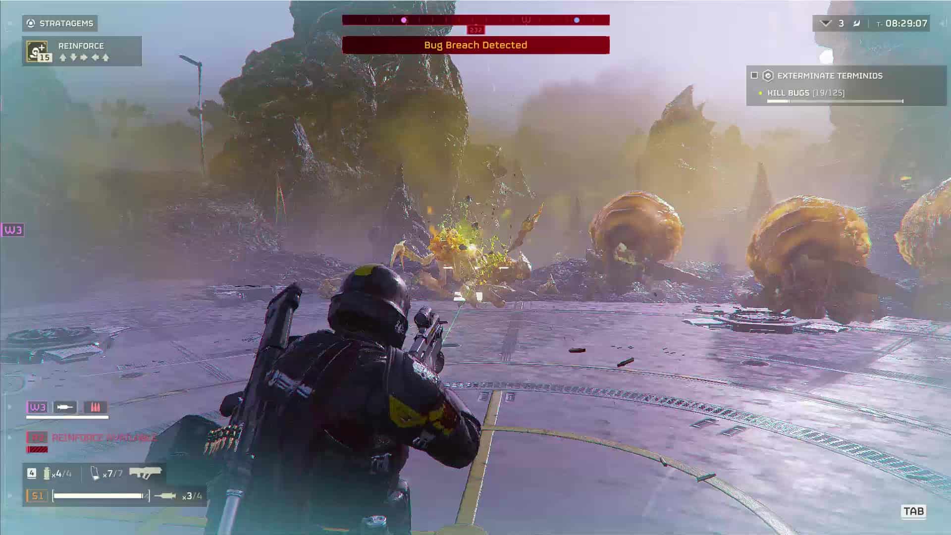 Helldivers 2 Bile Spewers: A player in combat against several Terminid enemies.
