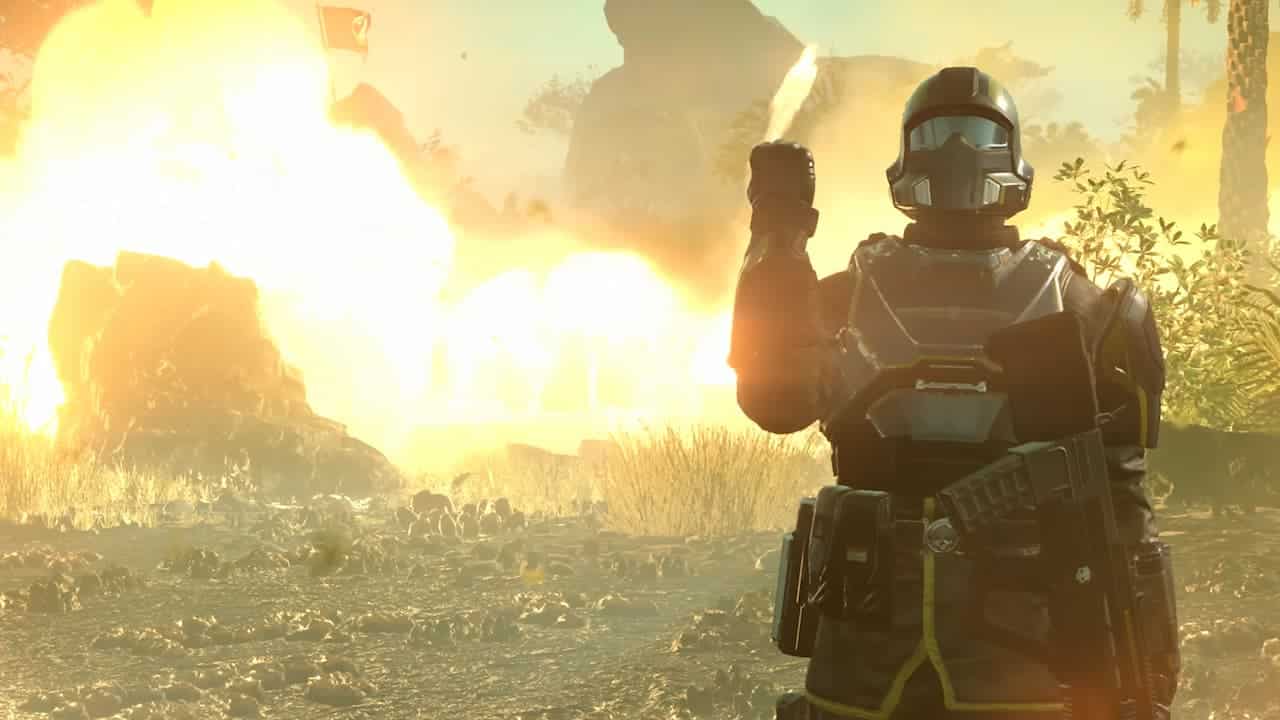 A Helldivers 2 soldier stands in front of an explosion
