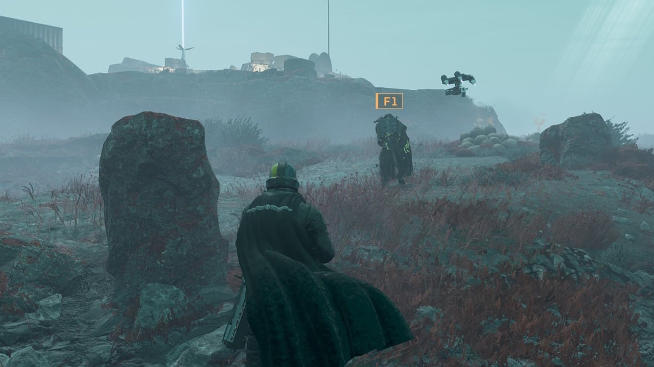 A player walks through a fog to reach an ally in Helldivers 2. Image captured by VideoGamer.