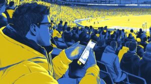 homme pariant sur son telephone dans un stade de football
