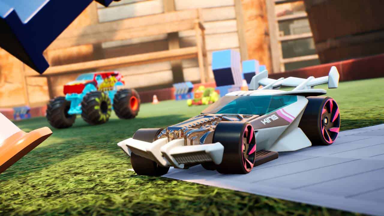 Hot Wheels Unleashed 2 - Turbocharged gameplay preview: A cinematic shot of a sports car with a huge spoiler, and a monster truck in the background.