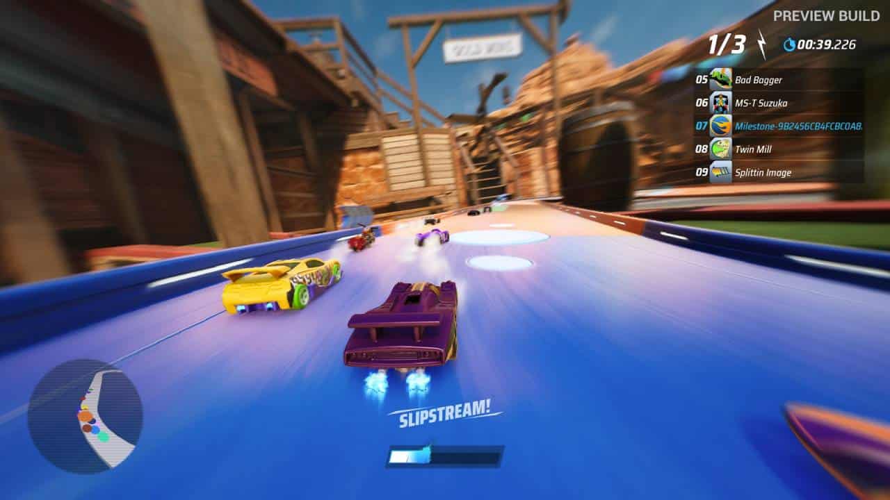 Hot Wheels Unleashed 2 - Turbocharged gameplay preview: Driving on a blue track, getting some slipstream from the car ahead.