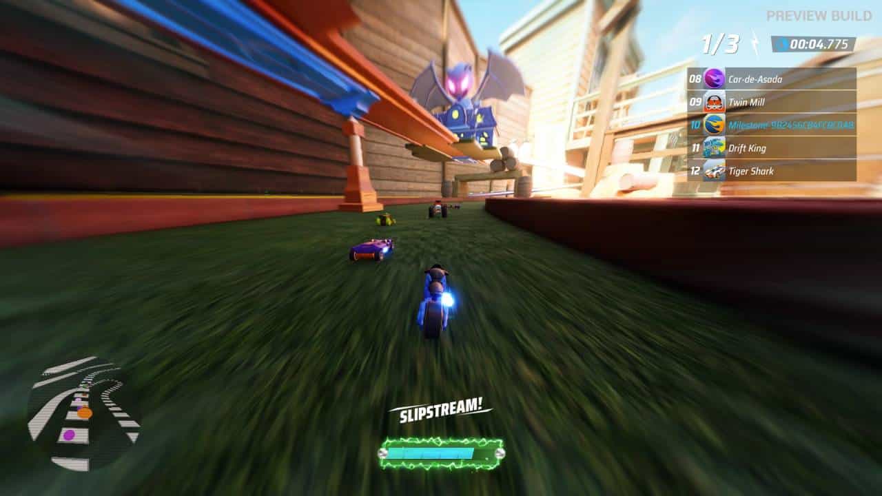 Hot Wheels Unleashed 2 - Turbocharged gameplay preview: Driving a motorbike along some grass, with cars ahead.