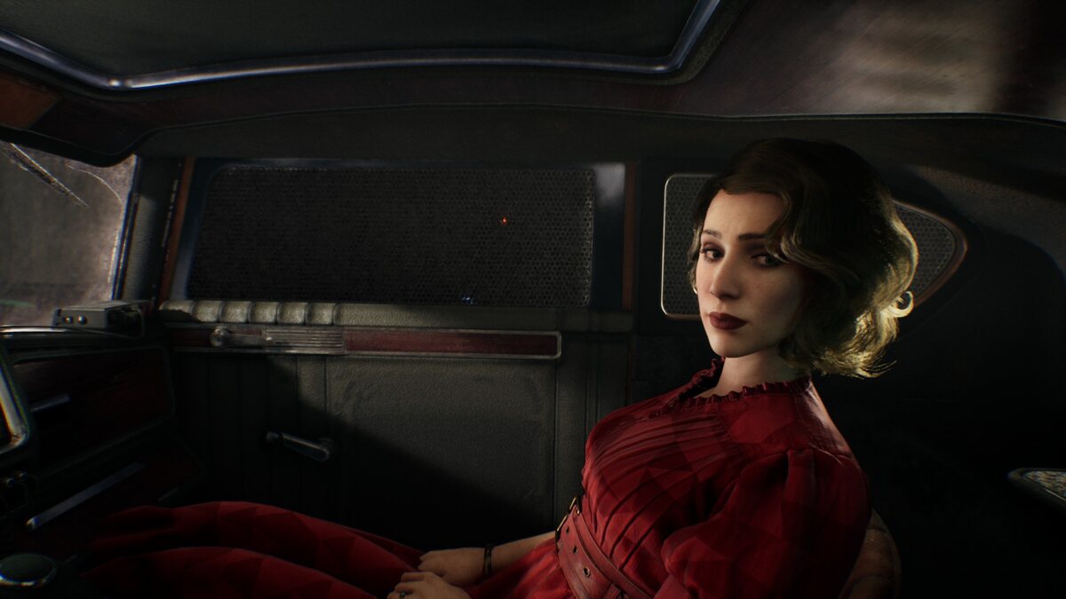 How long is Nobody Wants to Die: A woman in a red dress sitting in the passenger seat of an old car.