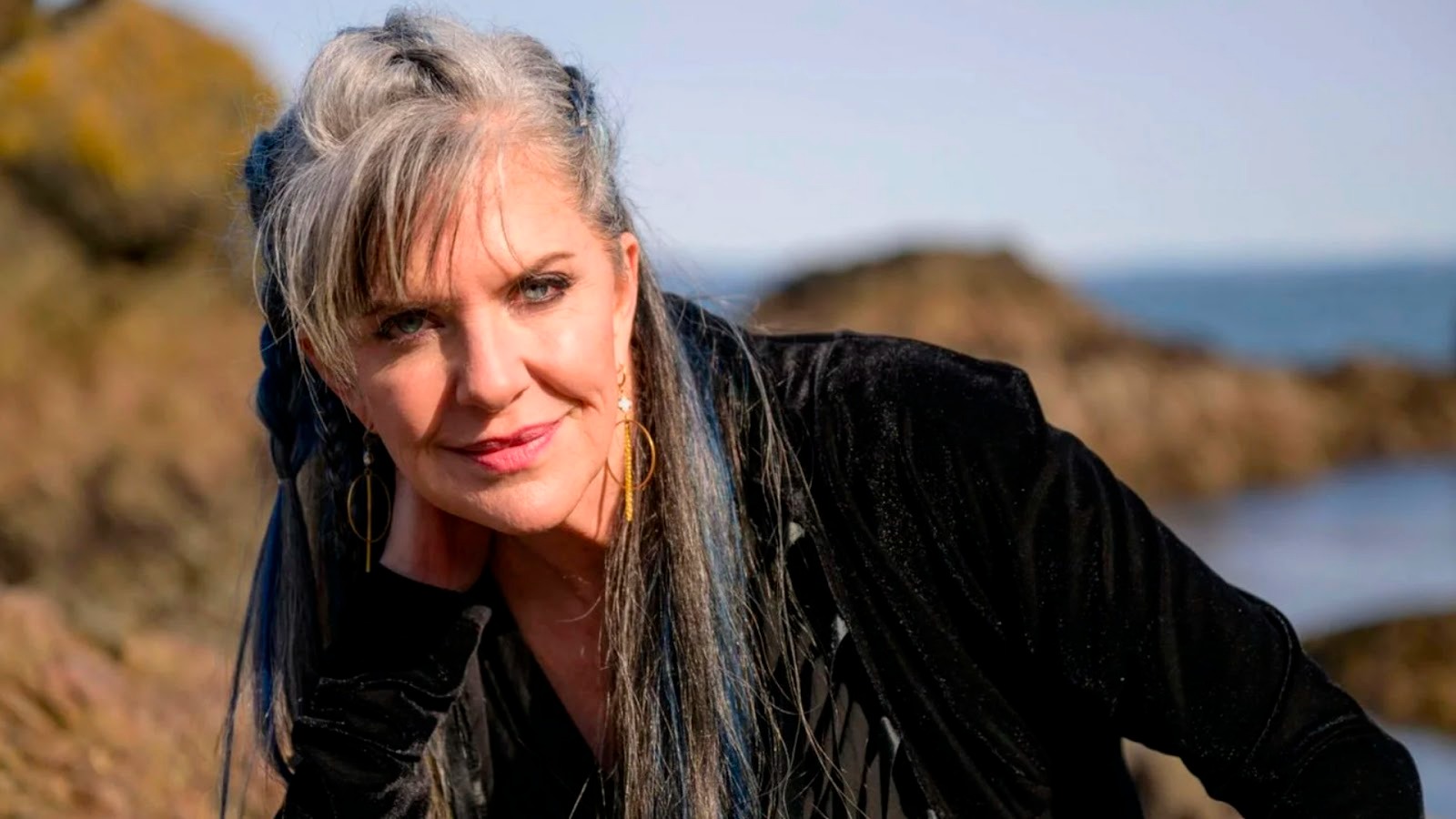 Jennifer Hale - An elegant headshot of Hale posing on a beach