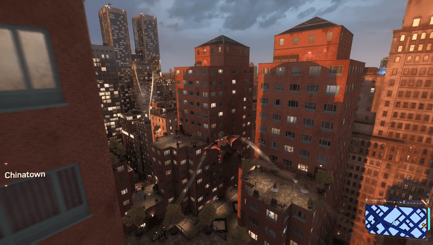         Description: A screenshot of Spider-Man gliding through the city.