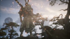 Is Black Myth Wukong a soulslike: Sun Wukong holding a spear standing on a tree looking into a sunrise.