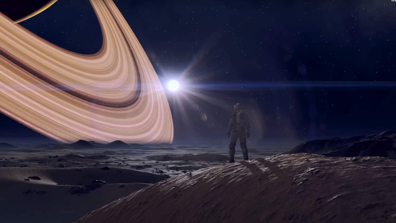 Starfield on Switch: An astronaut looks out at a ringed planet off to the top left from atop a moon-dust saturated hill.