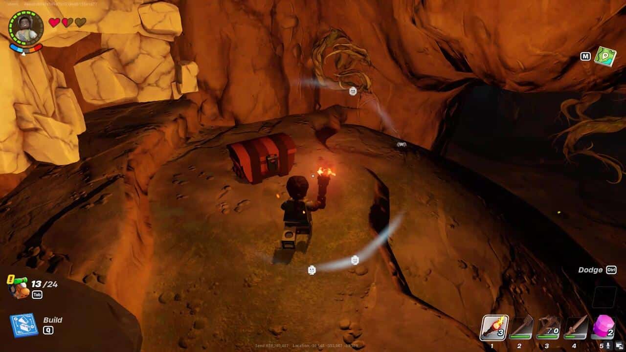 LEGO Fortnite how to find caves: A player next to a treasure chest in a cave