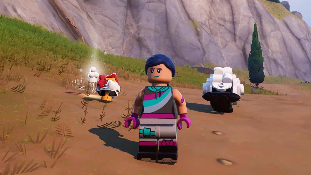 A LEGO character with blue hair and a teal scarf stands in a digital scenery with two other characters exploring a rocky landscape in the background.