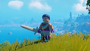 A LEGO character standing on a grassy hill, armed with a sword ready to take down enemies.