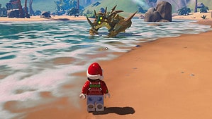 A LEGO Santa Claus in a Santa hat is walking on the beach, spreading holiday cheer.