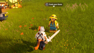 A lego character is standing in a grassy field. It appears to be a leak related to the popular video game Fortnite.