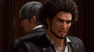 Like a Dragon Infinite Wealth review - Kiryu stands next to Kasuga in the game. Image captured by VideoGamer.