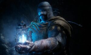 A man wielding a torch in the darkness: Lords of the Fallen.