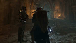 Two people standing in How to respec in Lords of the Fallen: A player speaks to Pieta at Skyrest Bridge.