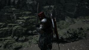 Lords of the Fallen how to upgrade weapons: A player character poses in a canyon with their sword upheld.