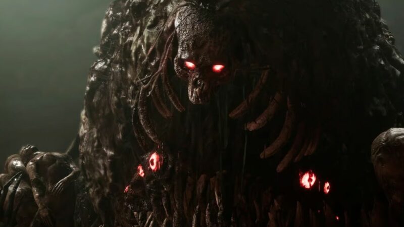 Lords of the fallen crossplay - demon with red eyes standing in a dark room.