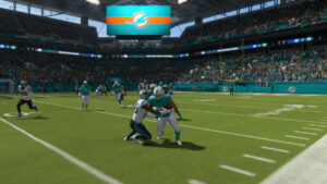 The Miami Dolphins are playing a football game in a stadium, showcasing their skills in Madden 24.