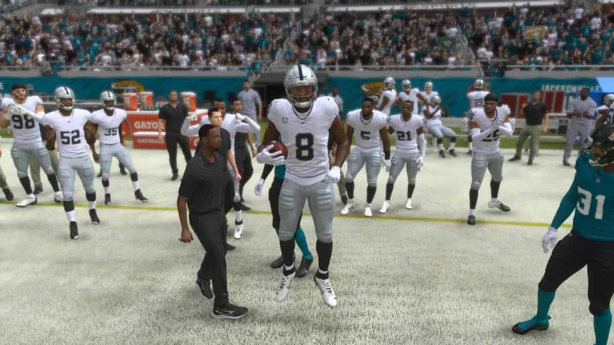The Oakland Raiders are on the field in a video game, with Madden 24 Redux.