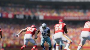 Madden 25 best edge runners: A football player in a white jersey running towards two players in red jerseys.