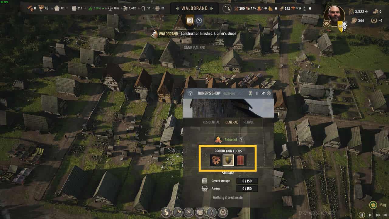 Manor Lords army: top-down view of a medieval village with production focus for the Joiner's Workshop highlighted in yellow.