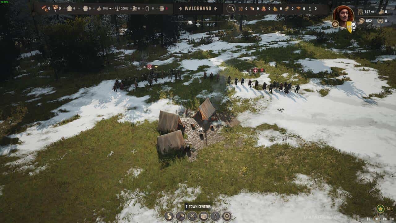 Manor Lords bandits: aerial view of a snowy landscape with a small encampment.