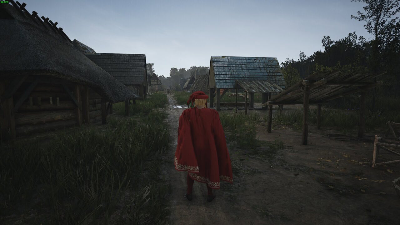 Manor Lords best developments: a lord in a red cloak walking through a medieval village.