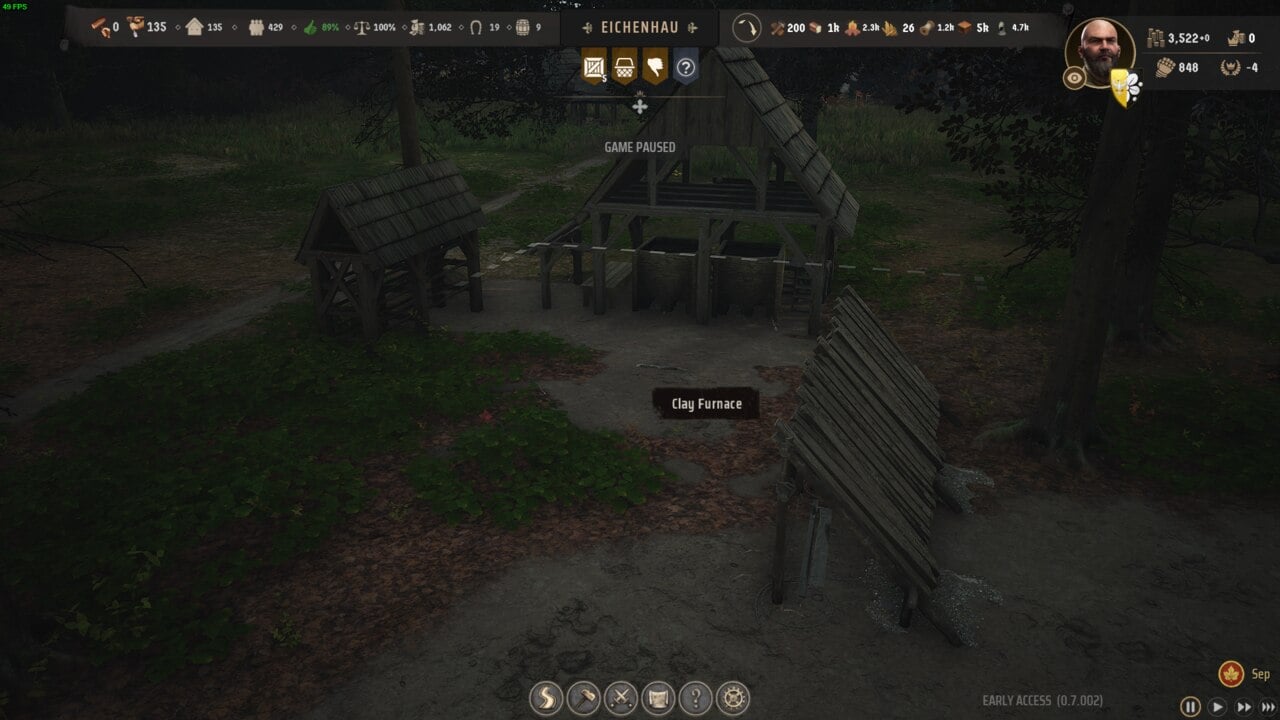Manor Lords buildings: Screenshot from a video game showing a rustic outdoor setting with benches, a wooden shelter, and a selection interface titled "Manor Lords buildings.