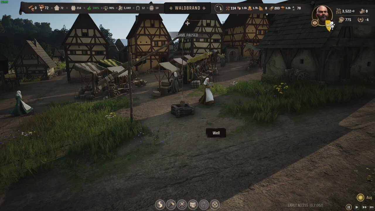 Manor Lords buildings: Screenshot from a medieval-themed video game, Manor Lords, showing a character walking through a market street lined with timber-framed buildings and stalls.
