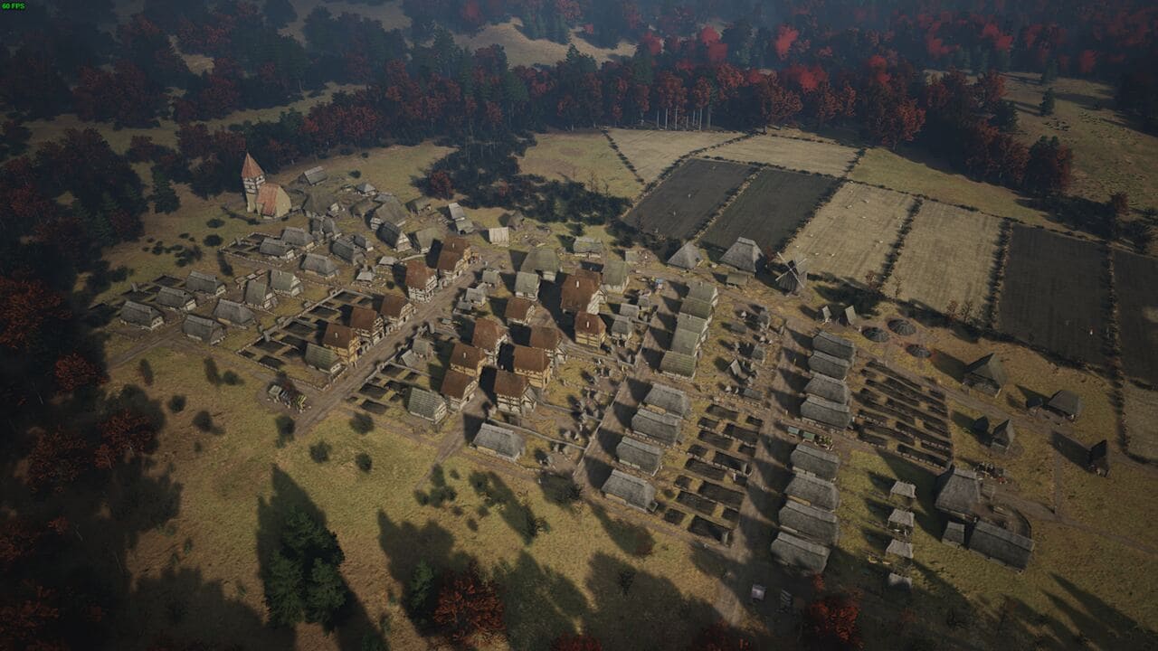 Manor Lords cheats: aerial view of a medieval village in autumn.